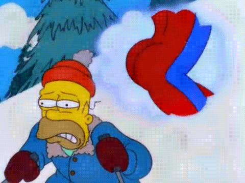 Homer Simpson aprendiendo a esquiar, obnubilado por el "como si no llevara nada" de Flanders y su equipación de esquí